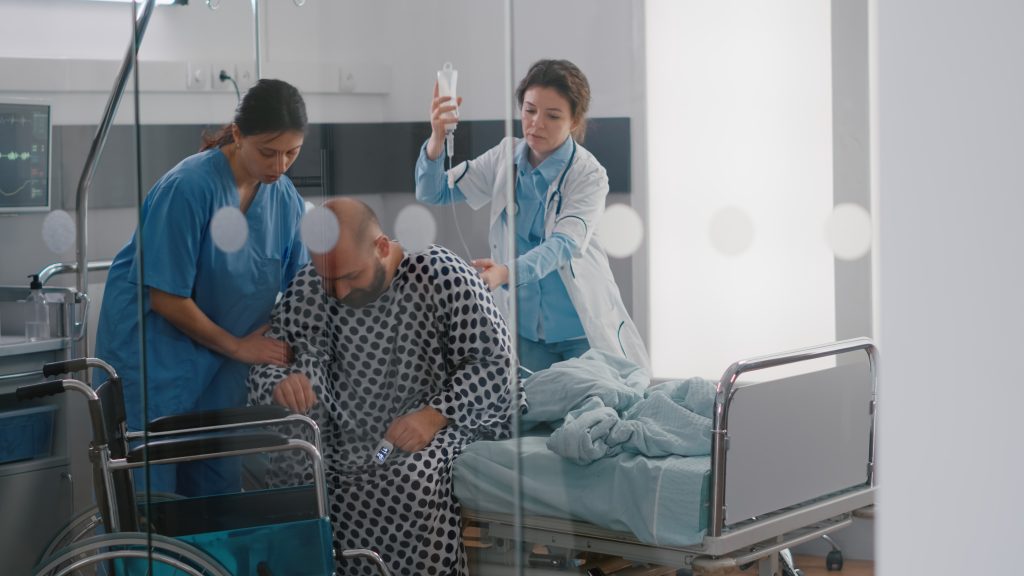 Medical team helping sick patient with leg injury fracture putting in wheelchair going on physiotherapy recovery in hospital ward. Doctor monitoring man checking respiratory health expertise SSUCv3H4sIAAAAAAAACnRSy27bMBD8FYFn0+VLJOVb0aYNCgTwLSjiIlg+FBGWRYOiUhRB/r0rJTnmtlzOzHJm+UIczMmTwwtJ47jMtUBNeSIHtiMlTiGWrXwuUrOtiiHVXBKM28lB9cMEl0gO0zKOrzsyV6jLHGdUxJOHGp8Qvp0/Rj28rH1yILcRxjp4KPHLHep6FEWBxeHVXZp9HEeYYl5m8rr7oBxjvo7xM9ifHYGnOPl/63QcX+IYYXvMA2mDAqGcoTJIS5UyknY6dtT61ljrdFSdQN3Ae+0Vb2nbckFVEI6CQhgLRvWcu14HhjDbyb5VXlMHQVHF+xZhvKeCC9MZ57RRBmE6qNbwzlLhQVLFBKO2M4GCNFwEJ4CHHmESvOkhatrq4KgyxqNui5NDyyJIcMJwgubOf2ssl/dsYQkpr7E+Z0wOmxKb15J8mp7eELkO6/4wu7xMtWAqBIeNOV/BYYiHHmlxRwaYZwSE98a6NvwI+fImMuW6BrgyA24TKy6FEZxJLa1kqrX4to+9DwmJ66CViaU/p/D+3IT6xEquBPeA9niHRpmnFhVob10bPWbmokSx5TpmCHV1h8w+l8u2/AIz+t8soOMr1AGbN4fTie+b+1zOaLw5Drnm+XTCfPfNj5vmNs/XVGFs7qGEhja/0Smitm+0Eb/nCYuvjKlHJrnlHbeP39DWnnGtdce7/a/jT/L6HwAA//8DAAXyPU0pAwAA